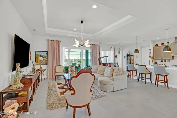 a living room with fireplace furniture and a flat screen tv