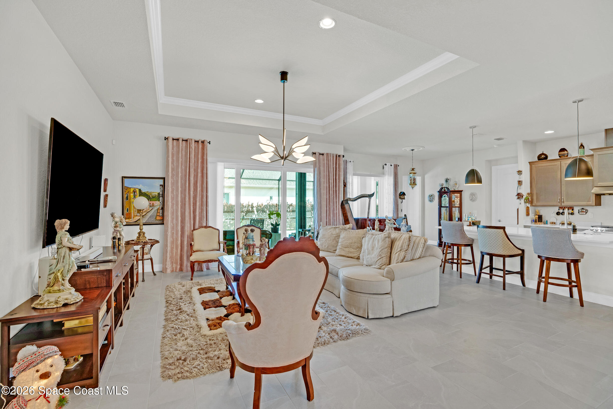 4160 Negal Circle Melbourne, FL 32901 - Photo 5 of 61 a living room with fireplace furniture and a flat screen tv