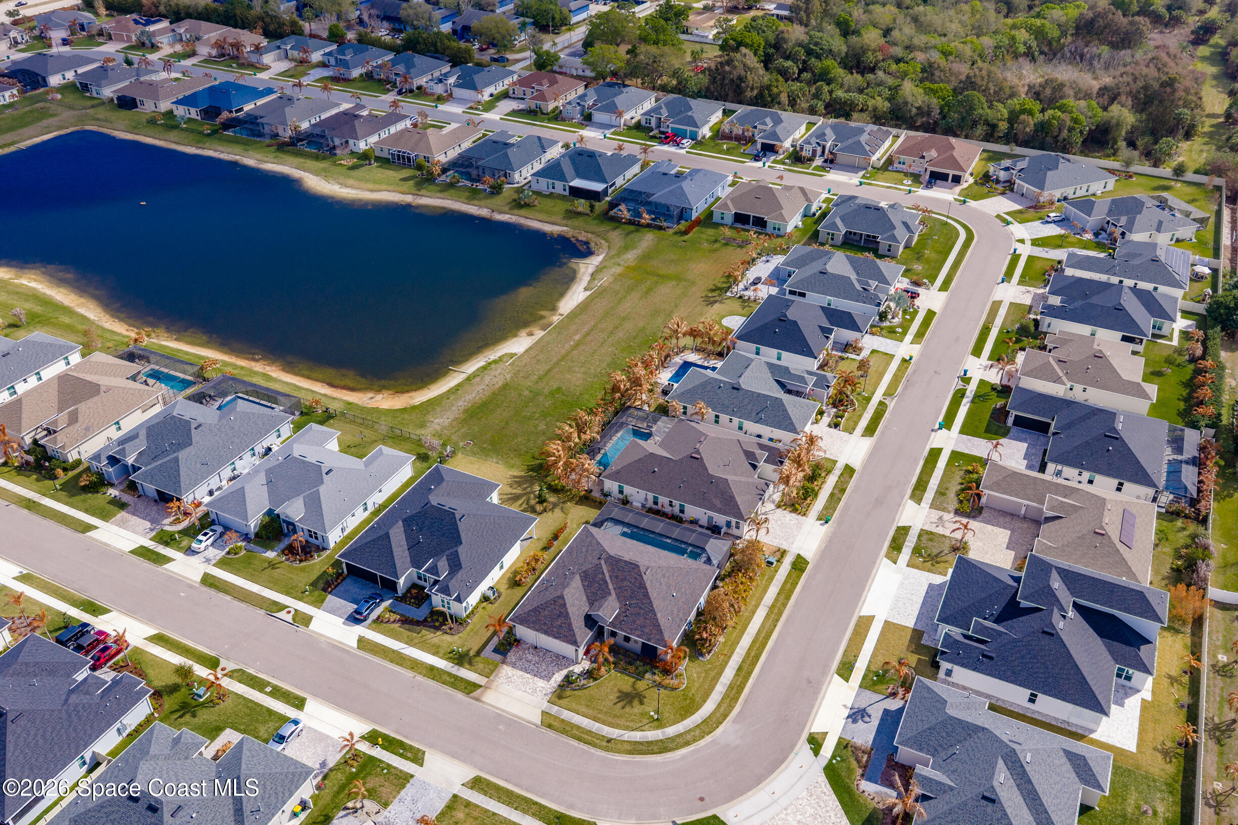 4160 Negal Circle Melbourne, FL 32901 - Photo 58 of 61 an aerial view of residential houses with outdoor space