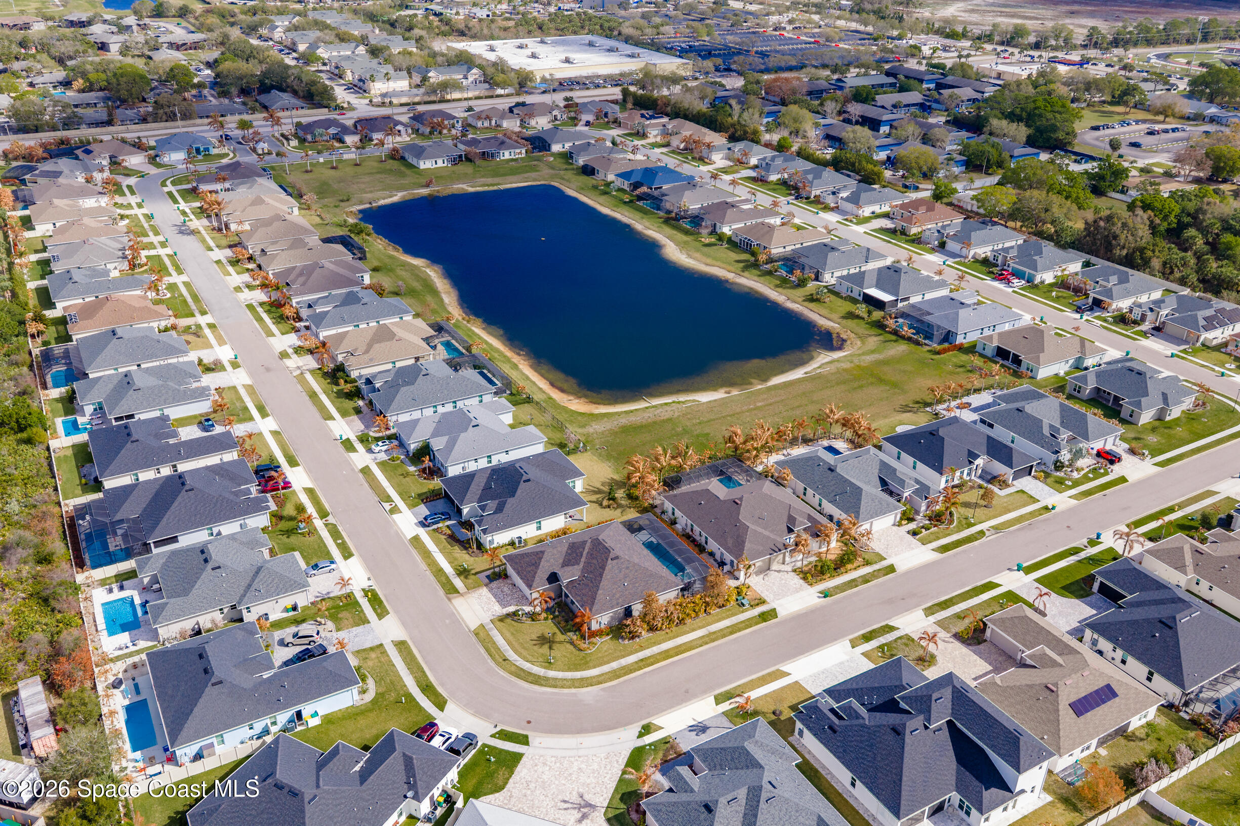 4160 Negal Circle Melbourne, FL 32901 - Photo 59 of 61 an aerial view of residential houses with outdoor space