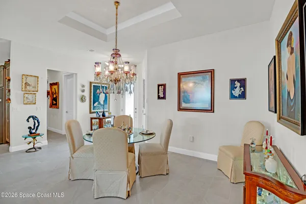 a dining room with furniture and window