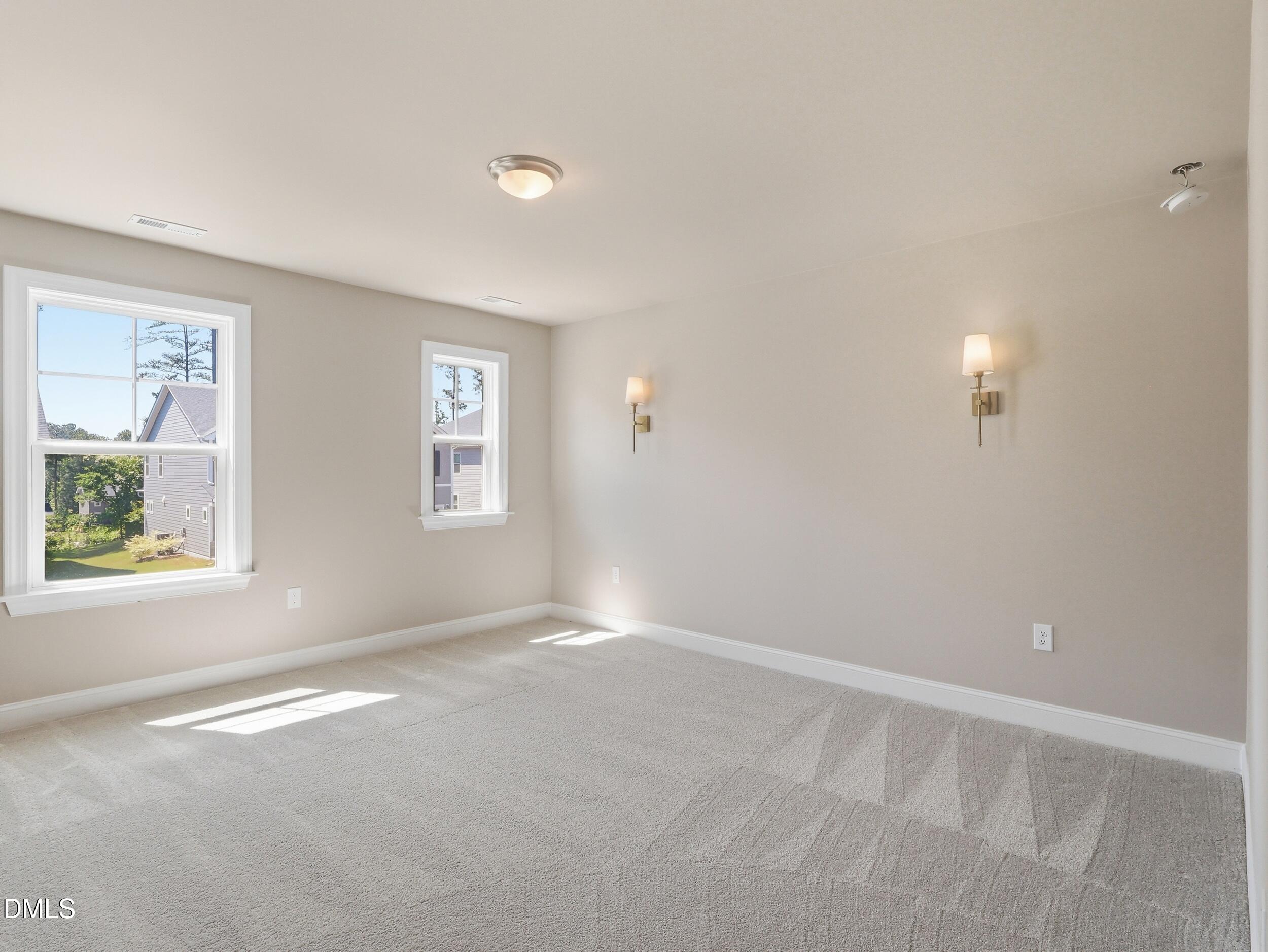 2709 Womble Ridge Drive New Hill, NC 27562 - Photo 41 of 60 an empty room with windows