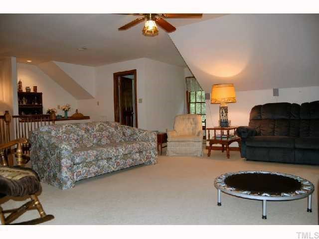11916 Straight A Way Lane Raleigh, NC 27613 - Photo 10 of 12 a living room with furniture and a lamp