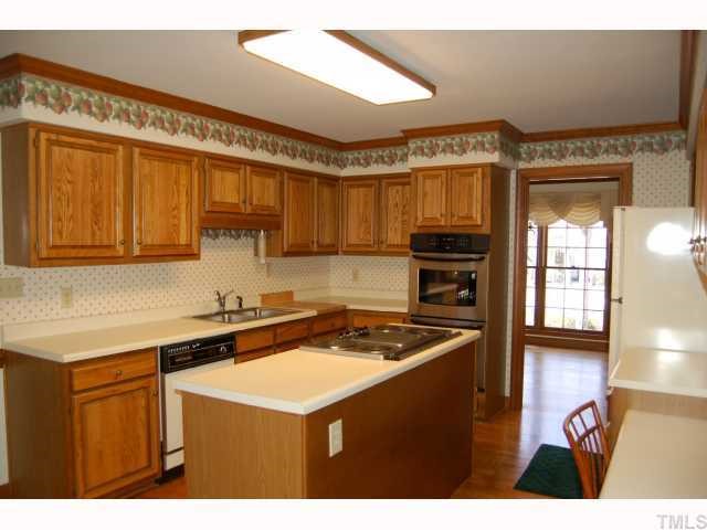 11916 Straight A Way Lane Raleigh, NC 27613 - Photo 2 of 12 a kitchen that has a sink and a stove