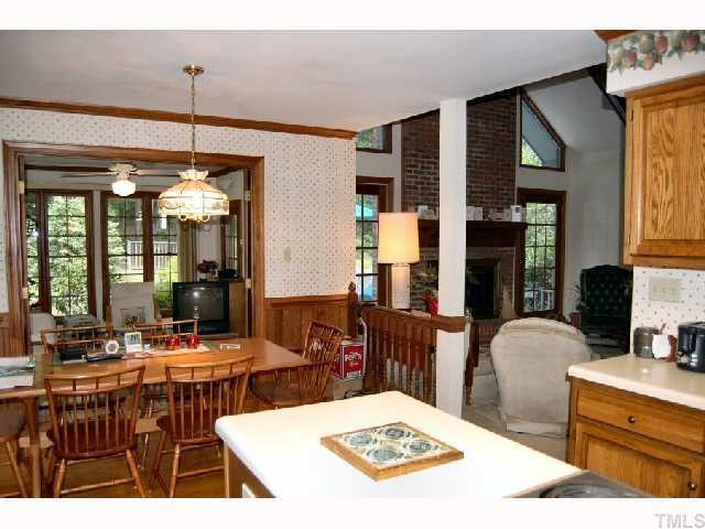 11916 Straight A Way Lane Raleigh, NC 27613 - Photo 4 of 12 a kitchen with a table and chairs