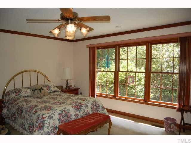 11916 Straight A Way Lane Raleigh, NC 27613 - Photo 6 of 12 a bedroom with a bed and a large window