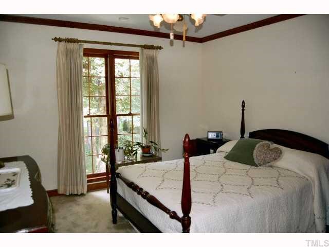 11916 Straight A Way Lane Raleigh, NC 27613 - Photo 8 of 12 a bedroom with a bed and a window