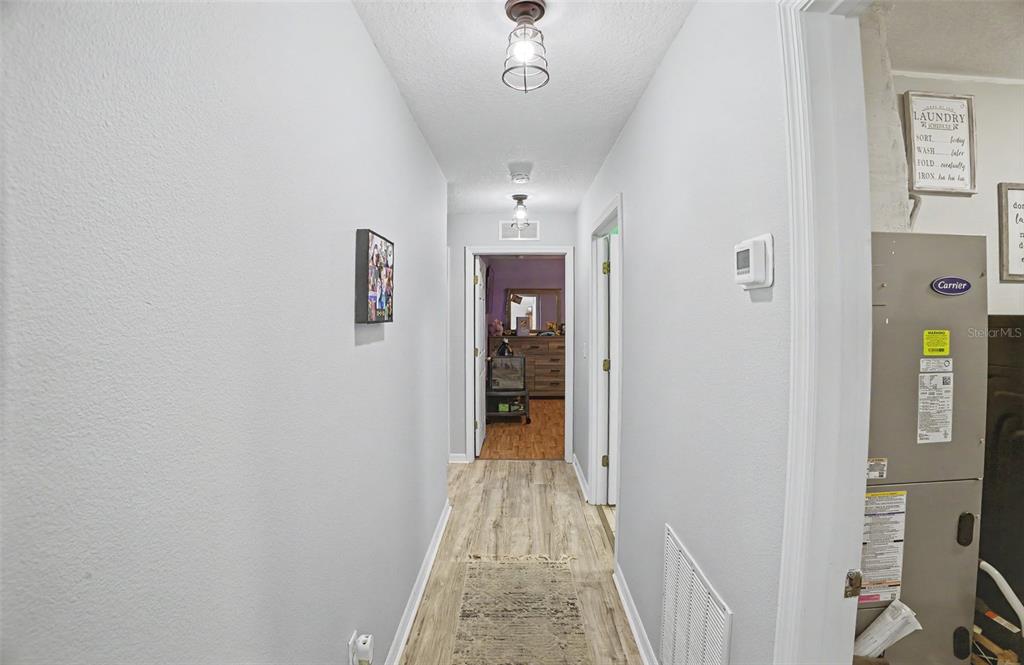 1886 Laurel Avenue Bunnell, FL 32110 - Photo 17 of 31 a view of a hallway view with wooden floor and staircase
