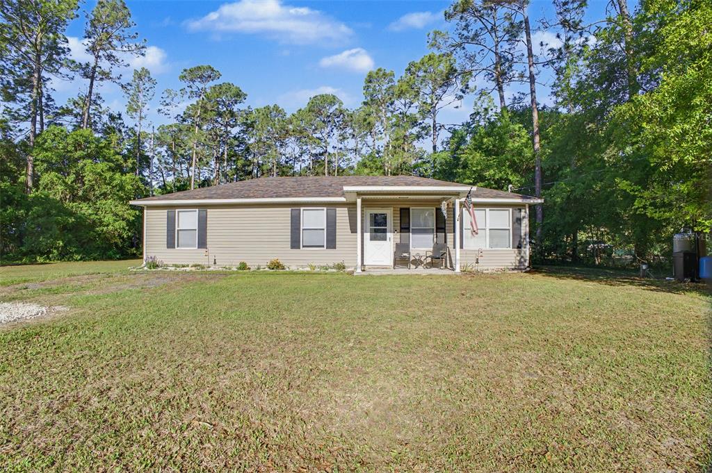 1886 Laurel Avenue Bunnell, FL 32110 - Photo 2 of 31 a view of a house with backyard and garden