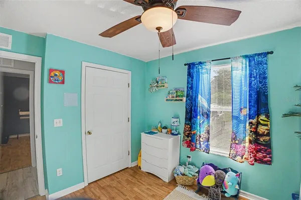 a room with toys and wooden floor