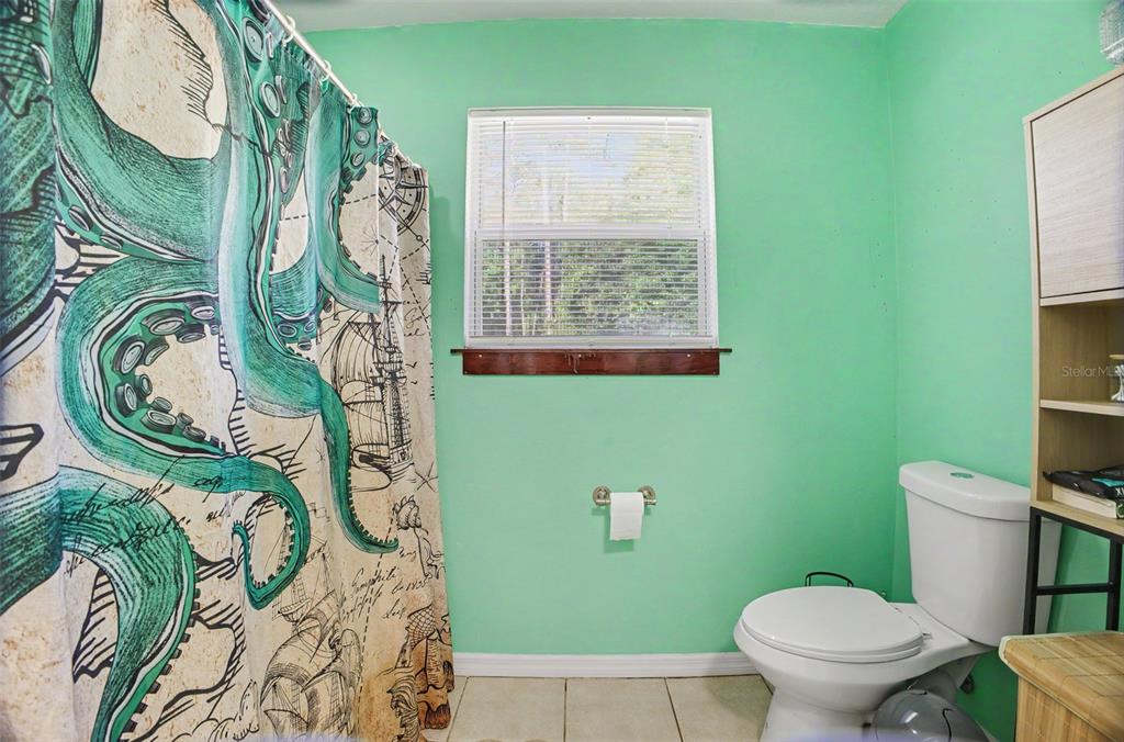 1886 Laurel Avenue Bunnell, FL 32110 - Photo 23 of 31 a bathroom with a toilet and a sink