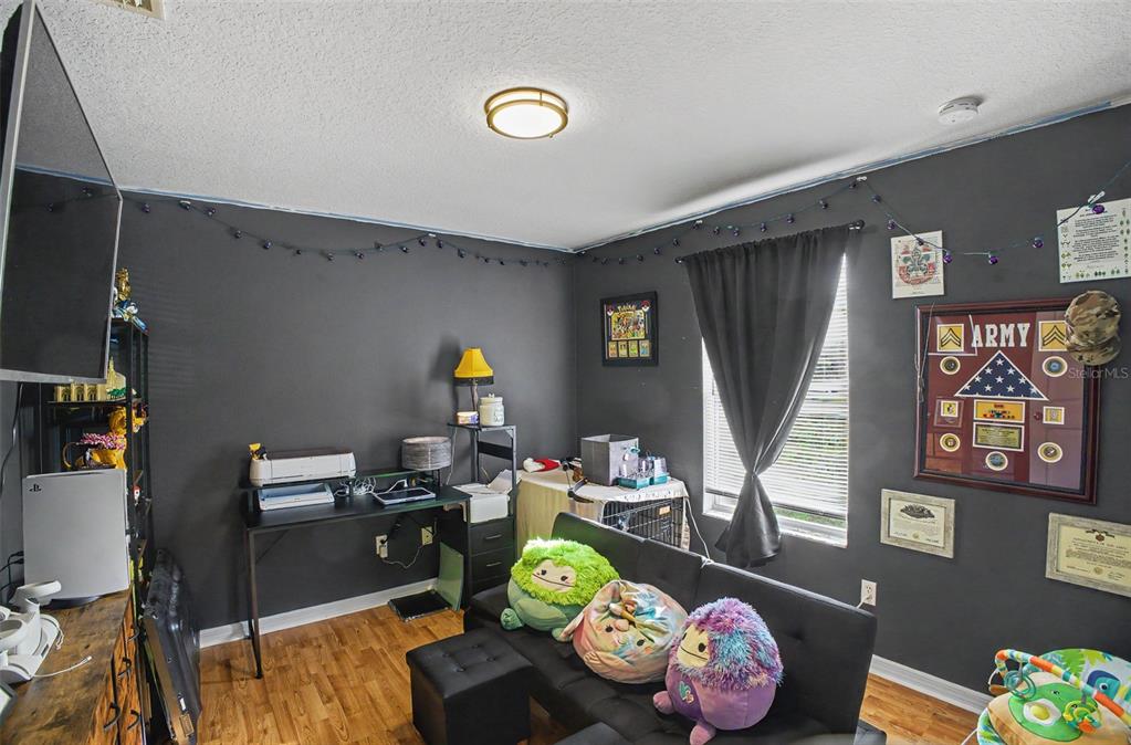 1886 Laurel Avenue Bunnell, FL 32110 - Photo 25 of 31 a living room with furniture and a wooden floor