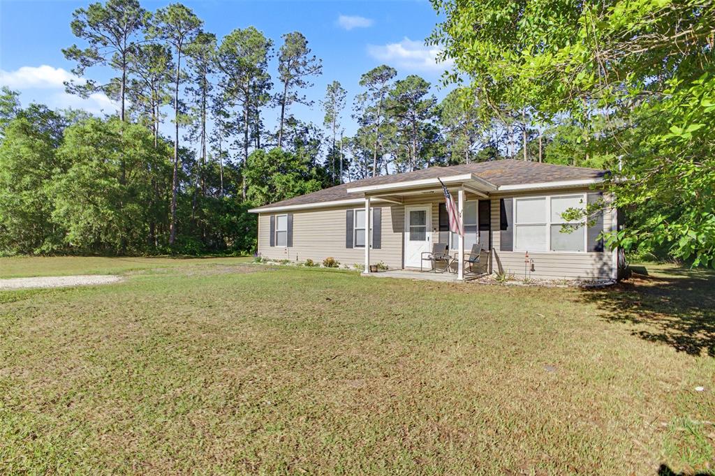 1886 Laurel Avenue Bunnell, FL 32110 - Photo 3 of 31 a view of a house with a yard