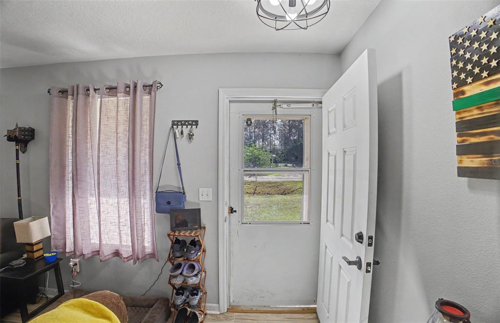 1886 Laurel Avenue Bunnell, FL 32110 - Photo 6 of 31 a view of a livingroom with furniture and a window