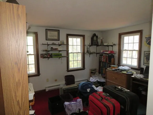 a room with furniture workspace and a window