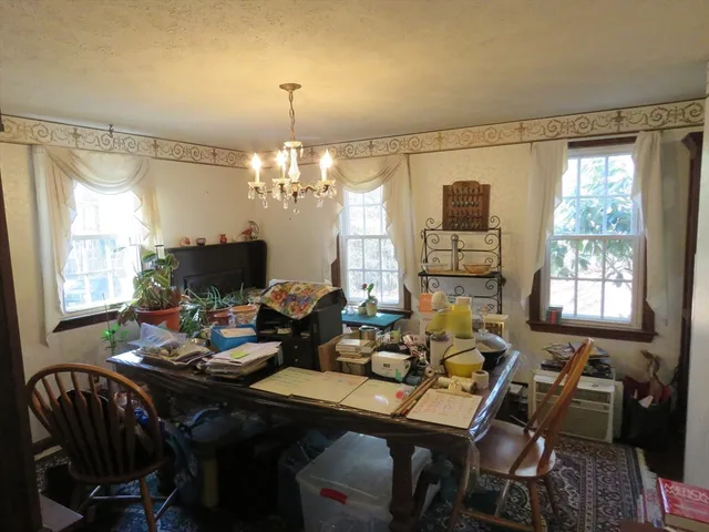 a room with furniture pool table and flat screen tv