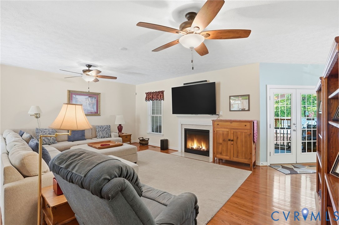 3600 Market Road Mechanicsville, VA 23111 - Photo 10 of 67 a bed room with furniture fireplace and flat screen tv