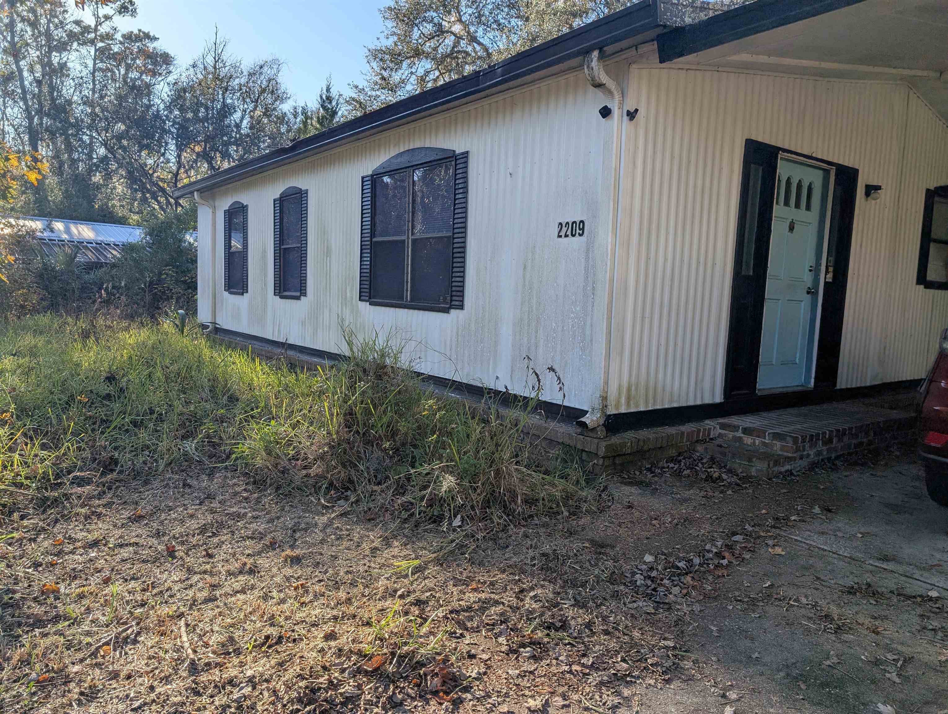 2209 Twin Fox Trail St. Augustine, FL 32086 - Photo 2 of 8 a view of a back yard of the house