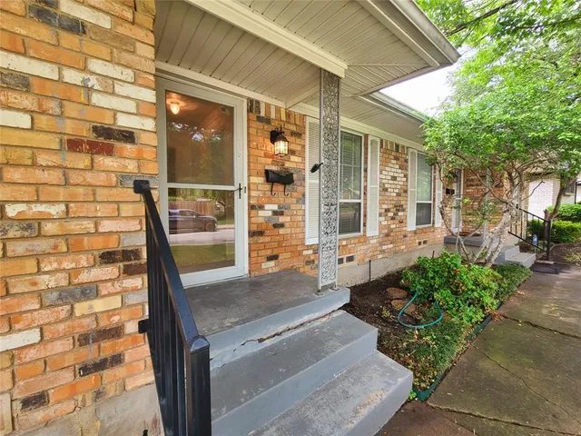 a front view of a house with outdoor space