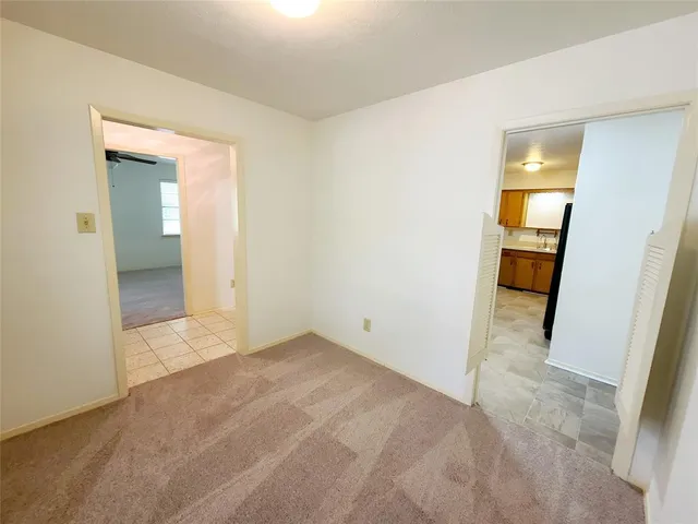 a view of an empty room and fire place