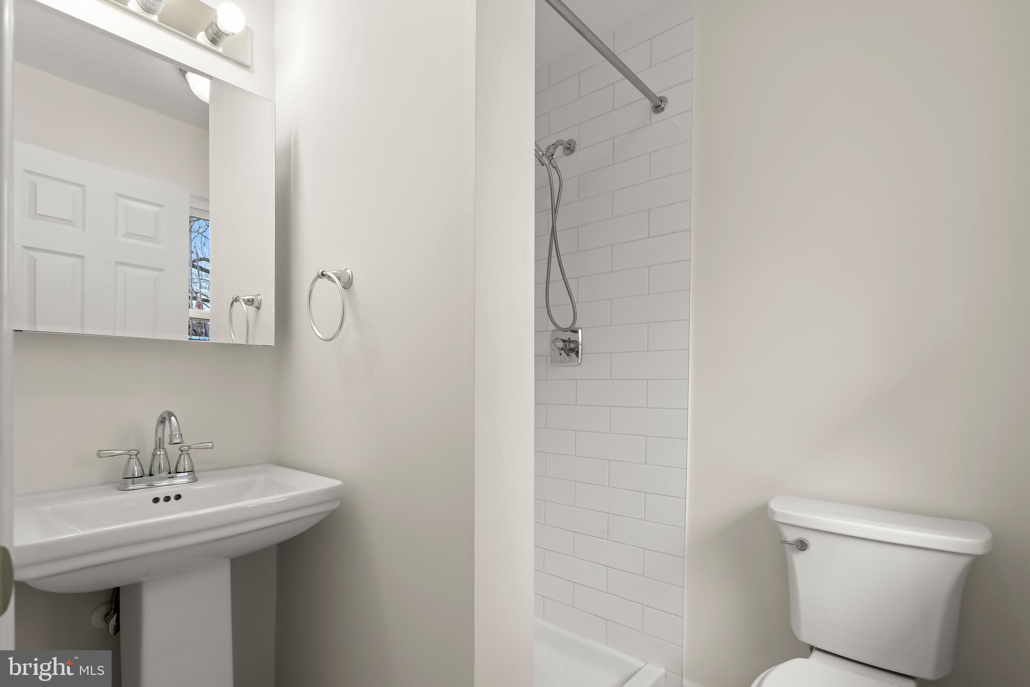 1255 Sheridan Road Crownsville, MD 21032 - Photo 24 of 40 a bathroom with a sink a toilet and shower