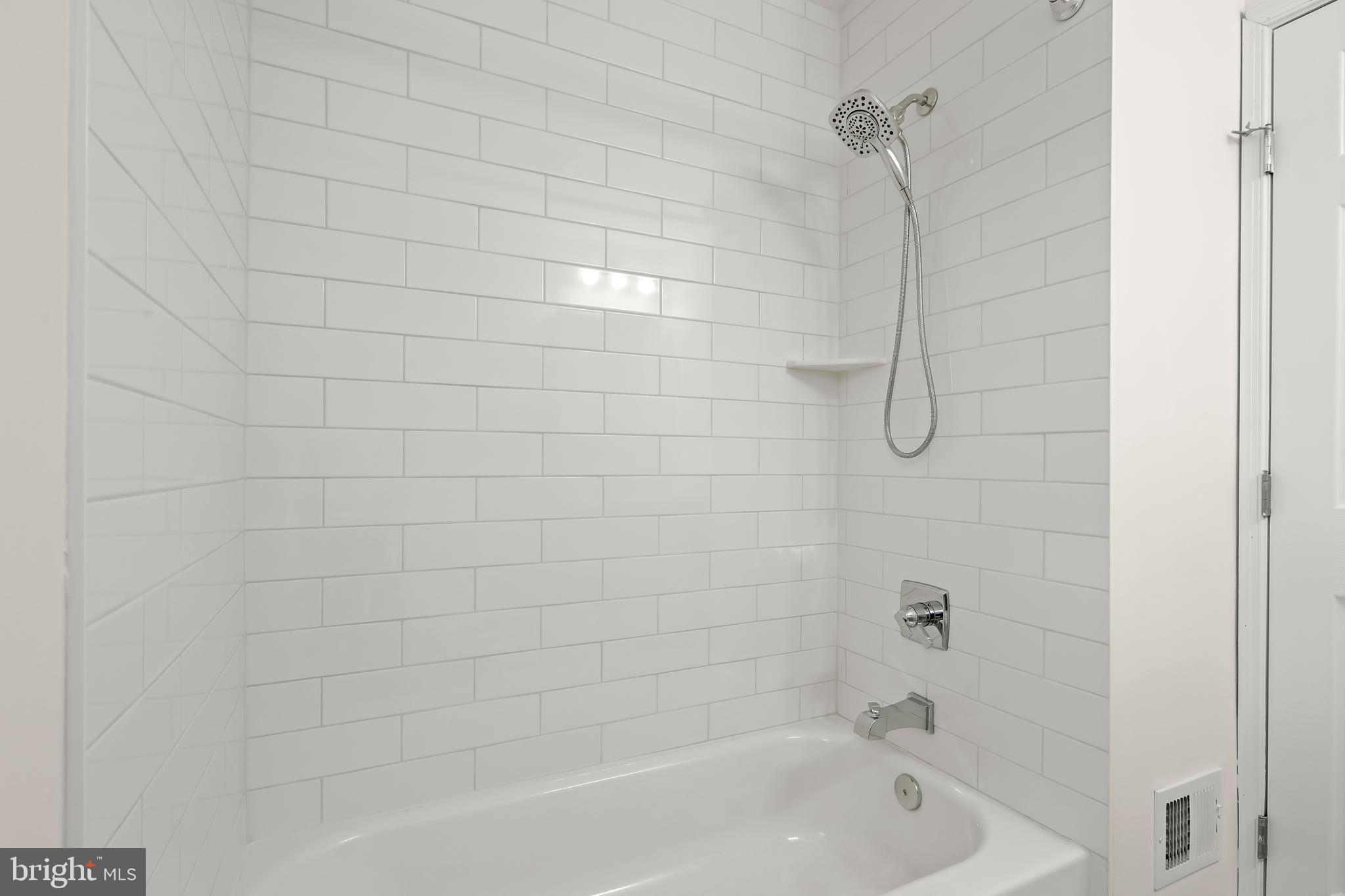 1255 Sheridan Road Crownsville, MD 21032 - Photo 32 of 40 a bathroom with a shower and a bath tub