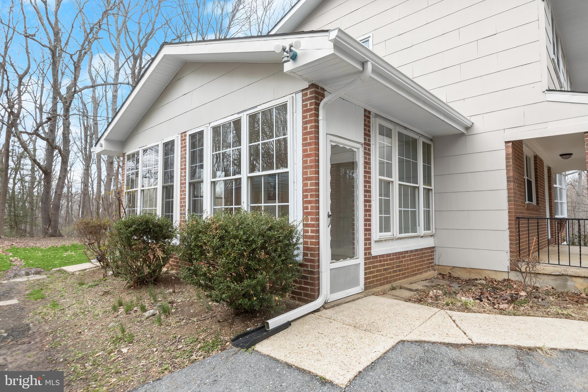 1255 Sheridan Road Crownsville, MD 21032 - Photo 35 of 40 a front view of a house with garden