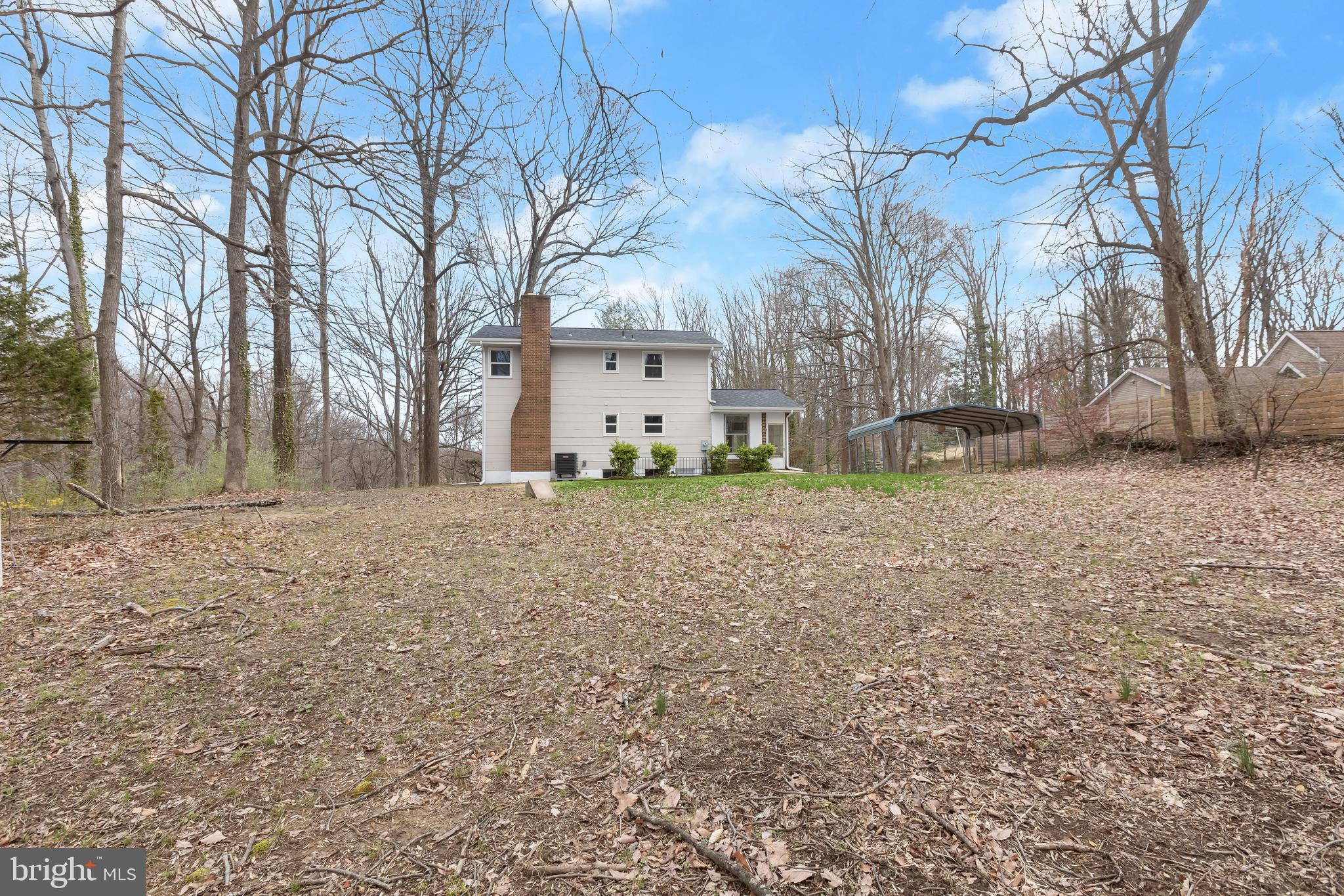 1255 Sheridan Road Crownsville, MD 21032 - Photo 37 of 40 a backyard of house with large trees