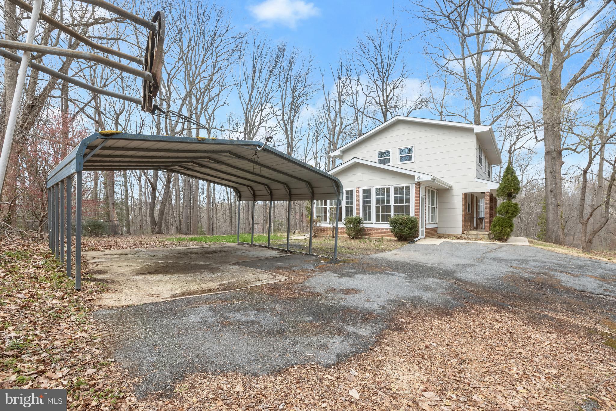 1255 Sheridan Road Crownsville, MD 21032 - Photo 38 of 40 a front view of a house with a yard and garage