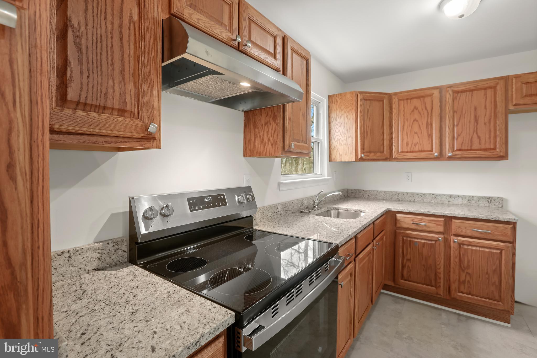 1255 Sheridan Road Crownsville, MD 21032 - Photo 10 of 40 a kitchen with a stove sink and cabinets