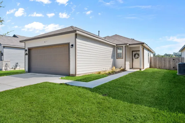 a view of a backyard of the house