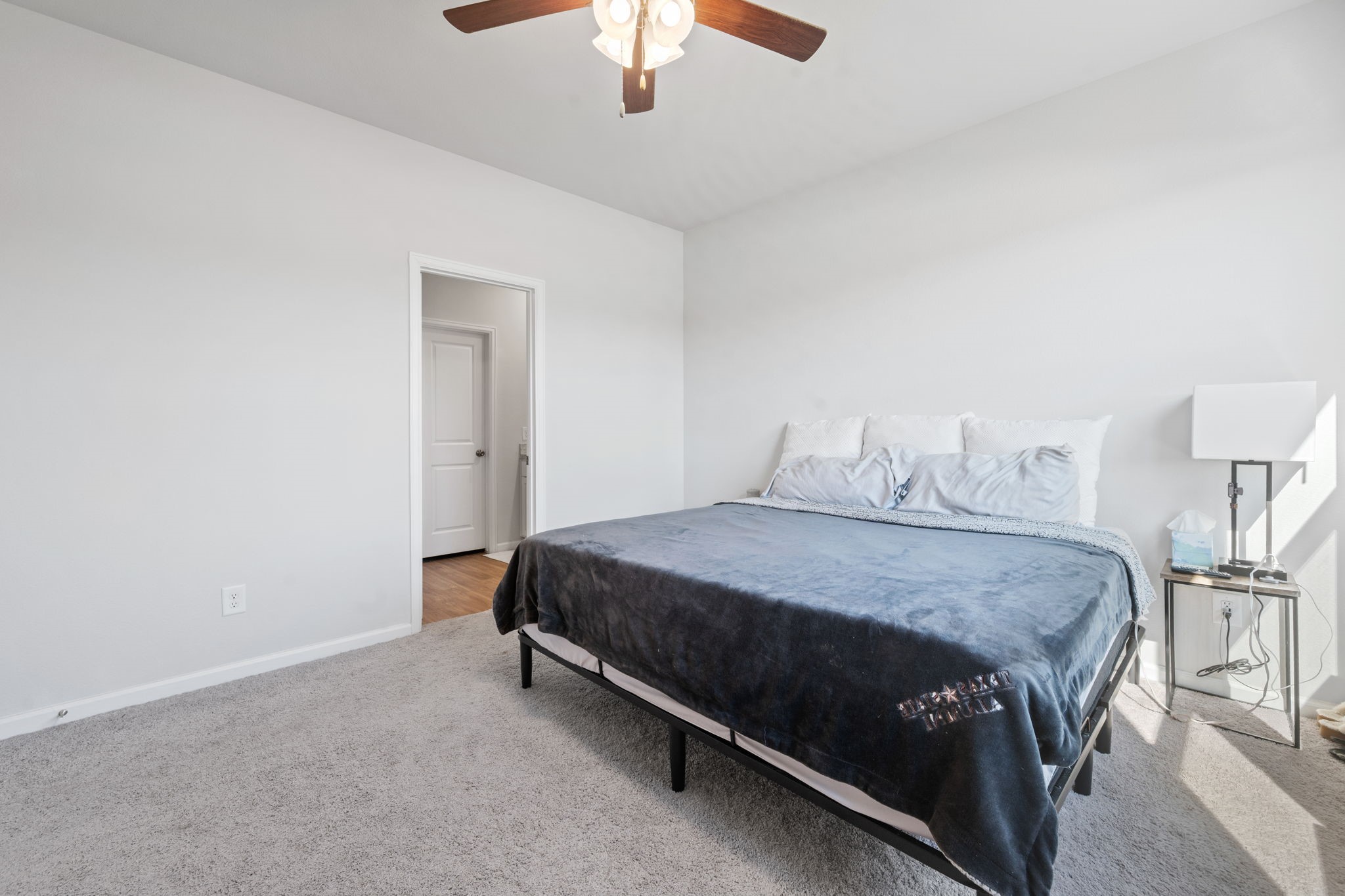 20819 Adventure Way Porter, TX 77365 - Photo 14 of 22 a bedroom with a bed and a chandelier