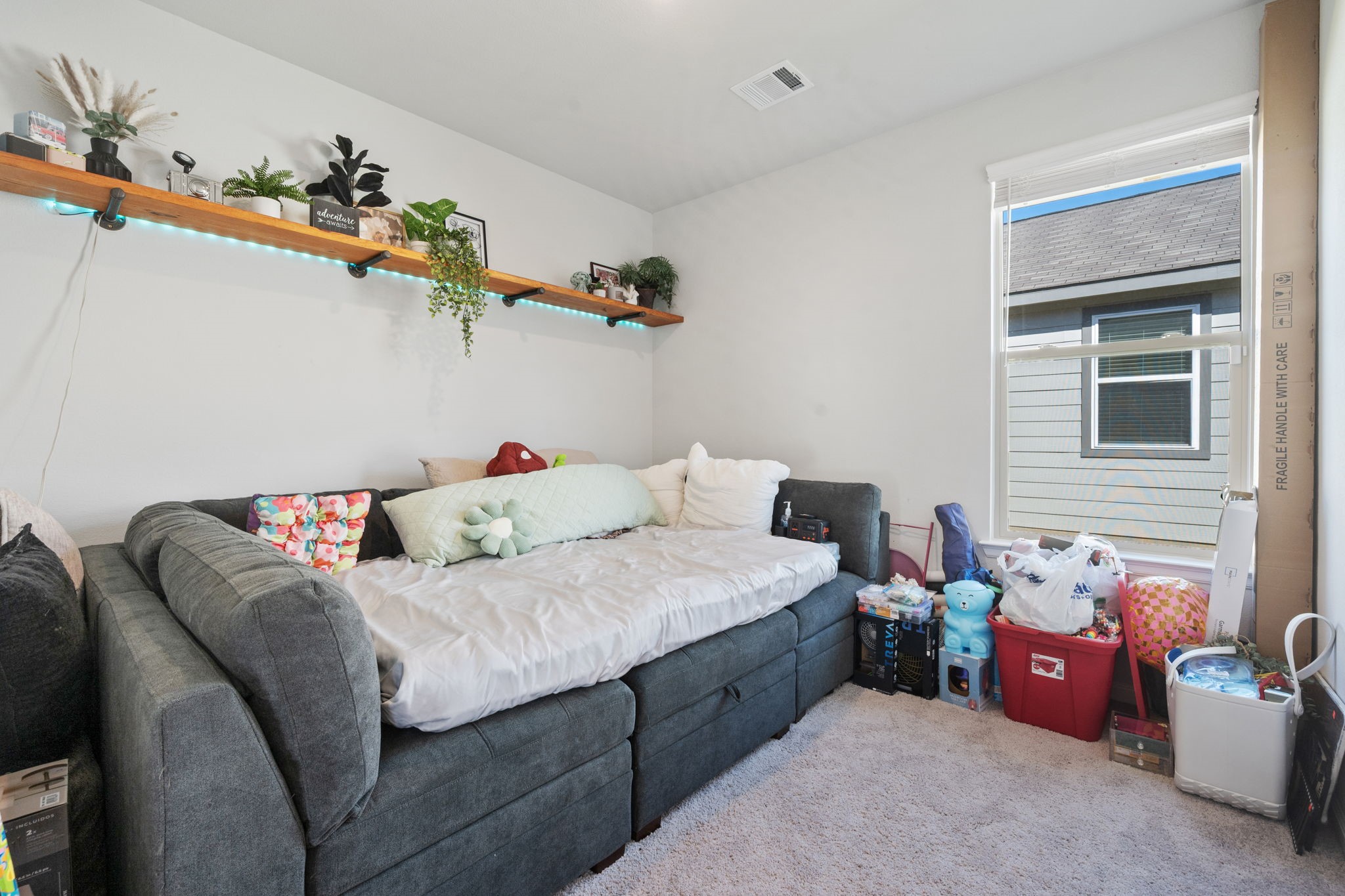 20819 Adventure Way Porter, TX 77365 - Photo 18 of 22 a bedroom with a bed and a couch