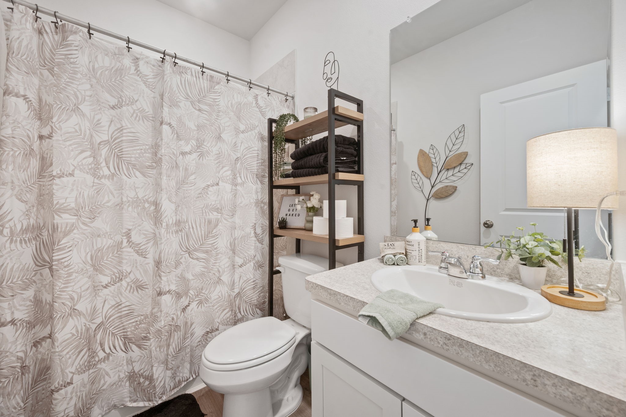 20819 Adventure Way Porter, TX 77365 - Photo 19 of 22 a bathroom with a granite countertop sink mirror vanity and toilet