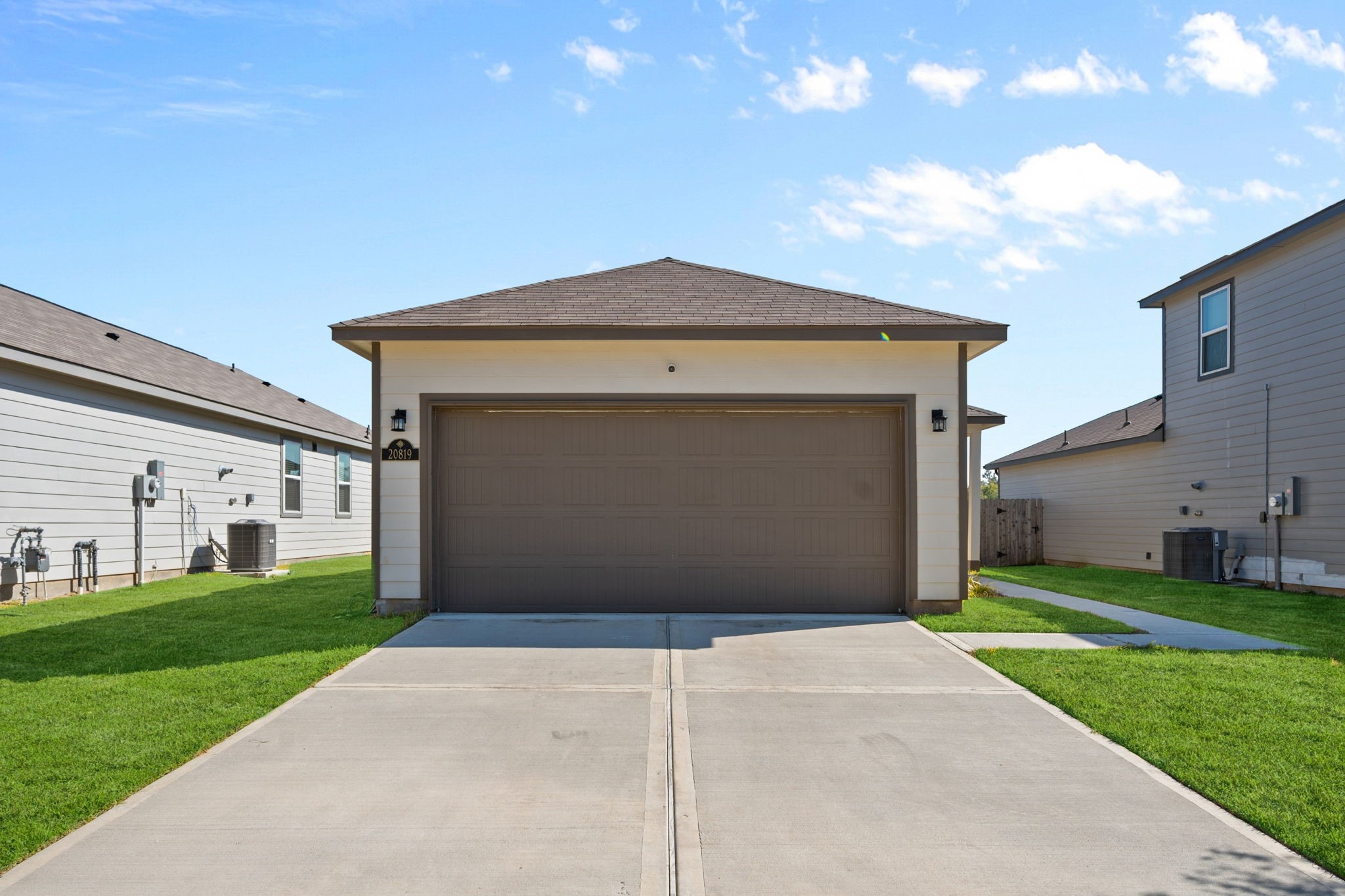 20819 Adventure Way Porter, TX 77365 - Photo 2 of 22 a front view of a house with a yard and garage