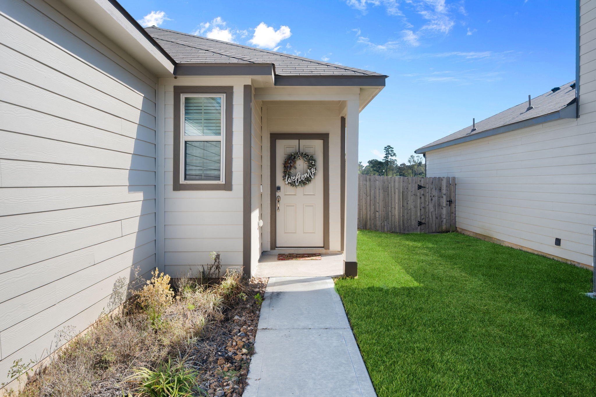 20819 Adventure Way Porter, TX 77365 - Photo 3 of 22 a front view of a house with garden