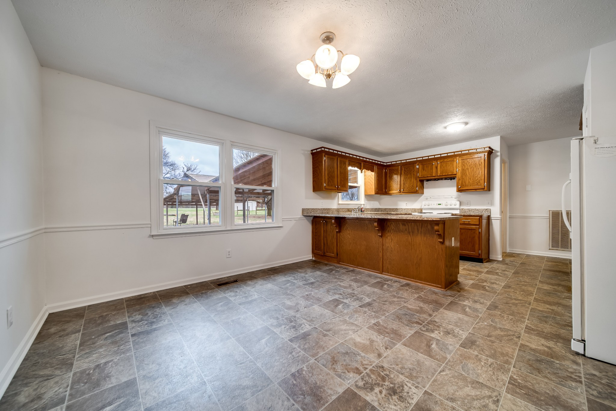 548 Goshen Road Lebanon, TN 37087 - Photo 6 of 23 a view of kitchen with granite countertop cabinets and window
