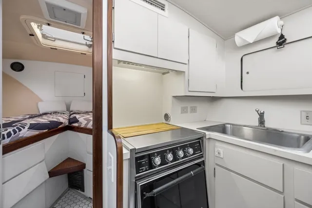 a kitchen with a stove and a sink