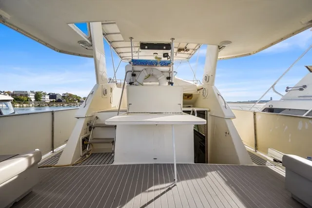 a view of a kitchen with furniture and wooden floor