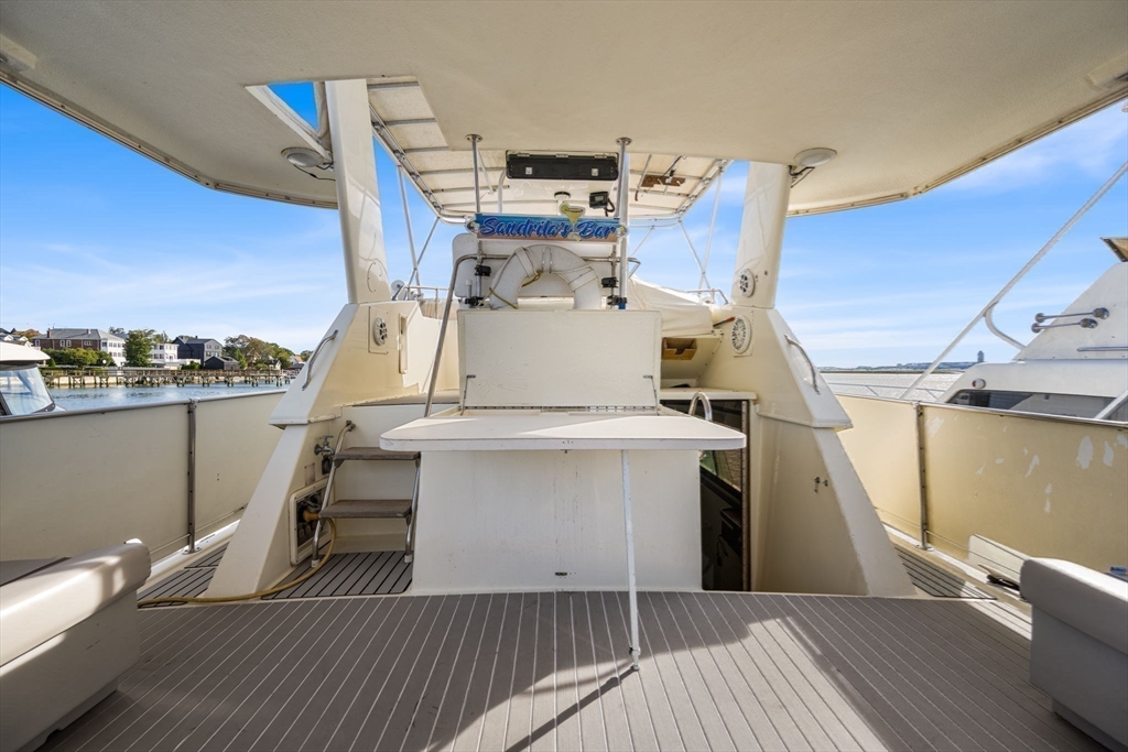 550 Pleasant Street, Unit 11D Winthrop, MA 02152 - Photo 21 of 30 a view of a kitchen with furniture and wooden floor