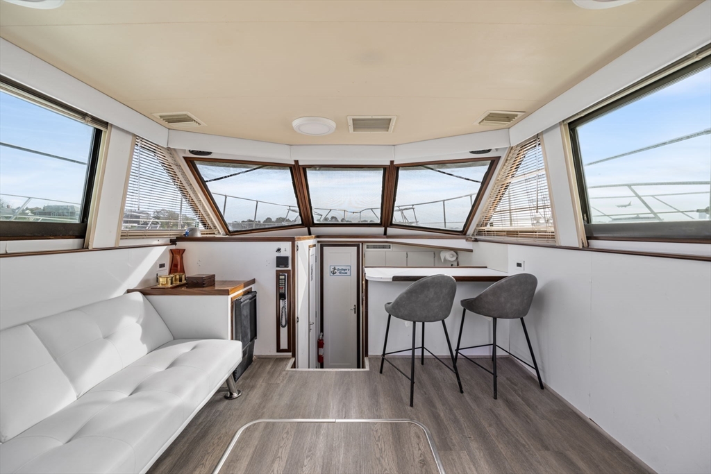 550 Pleasant Street, Unit 11D Winthrop, MA 02152 - Photo 5 of 30 a living room with furniture and a large window