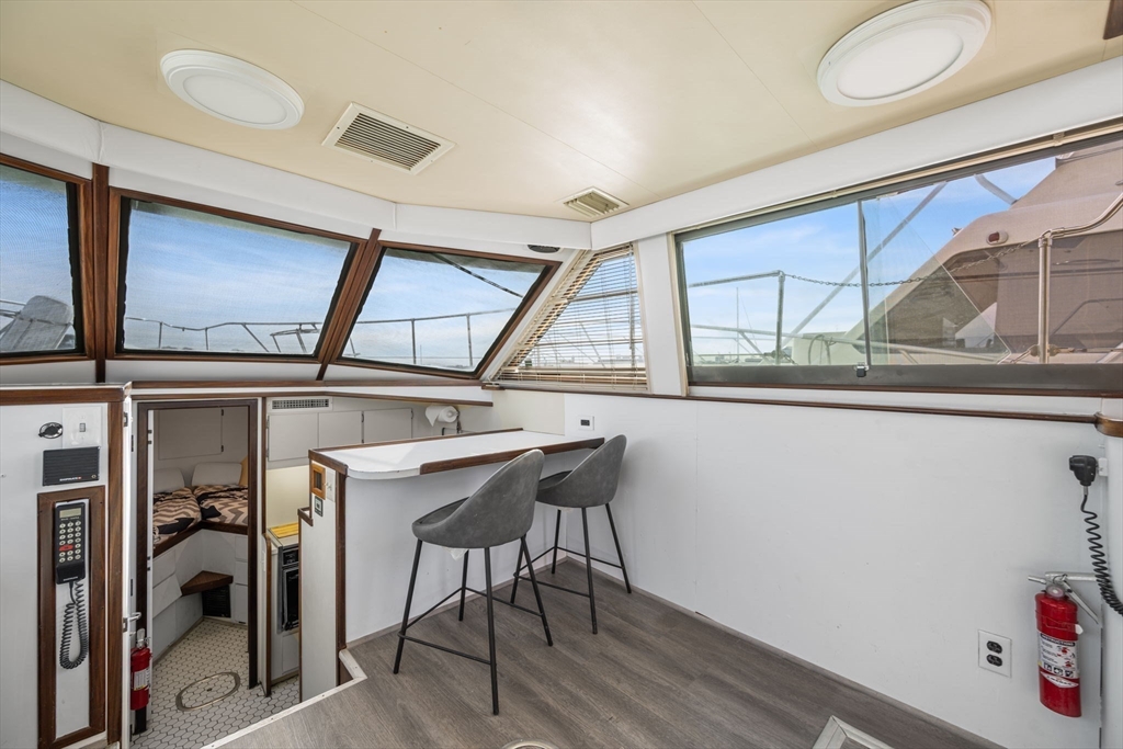 550 Pleasant Street, Unit 11D Winthrop, MA 02152 - Photo 7 of 30 a view of a hallway with furniture and a window