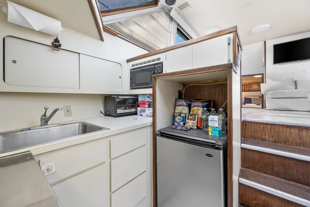 a kitchen with sink cabinets and appliances