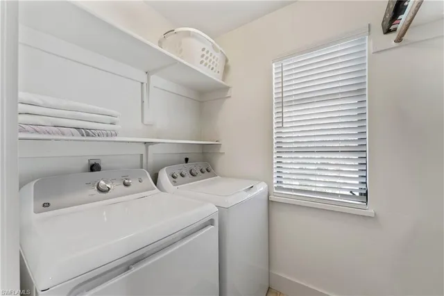 a bedroom with two beds and painted walls