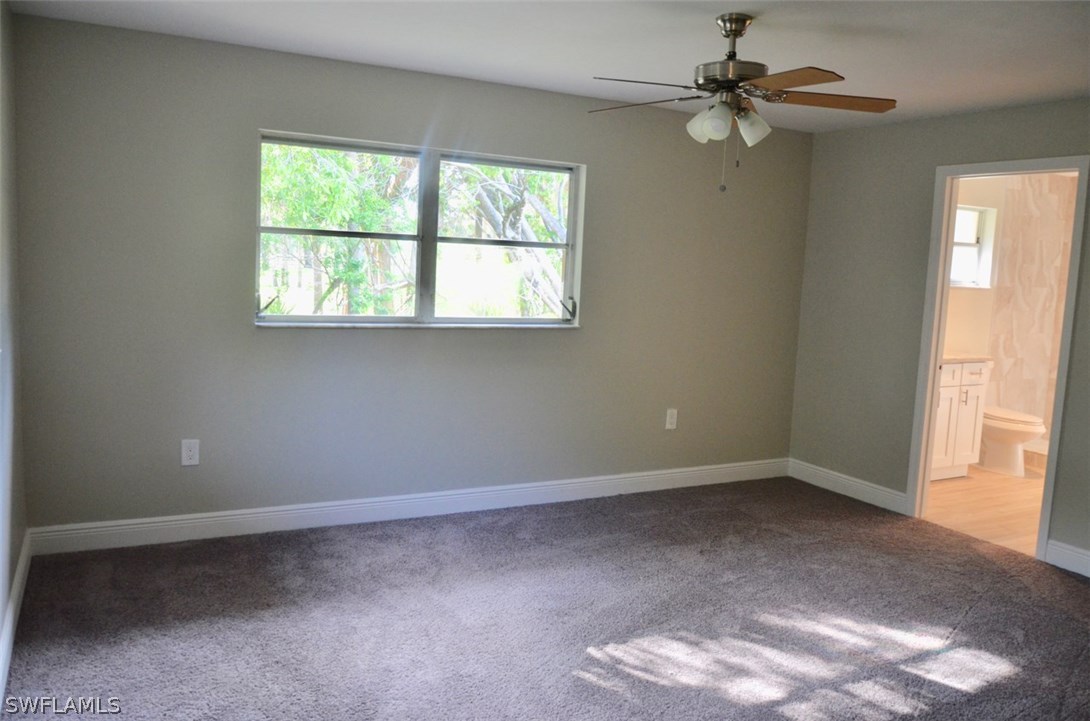 14120 River Road Fort Myers, FL 33905 - Photo 20 of 35 an empty room with windows and fan