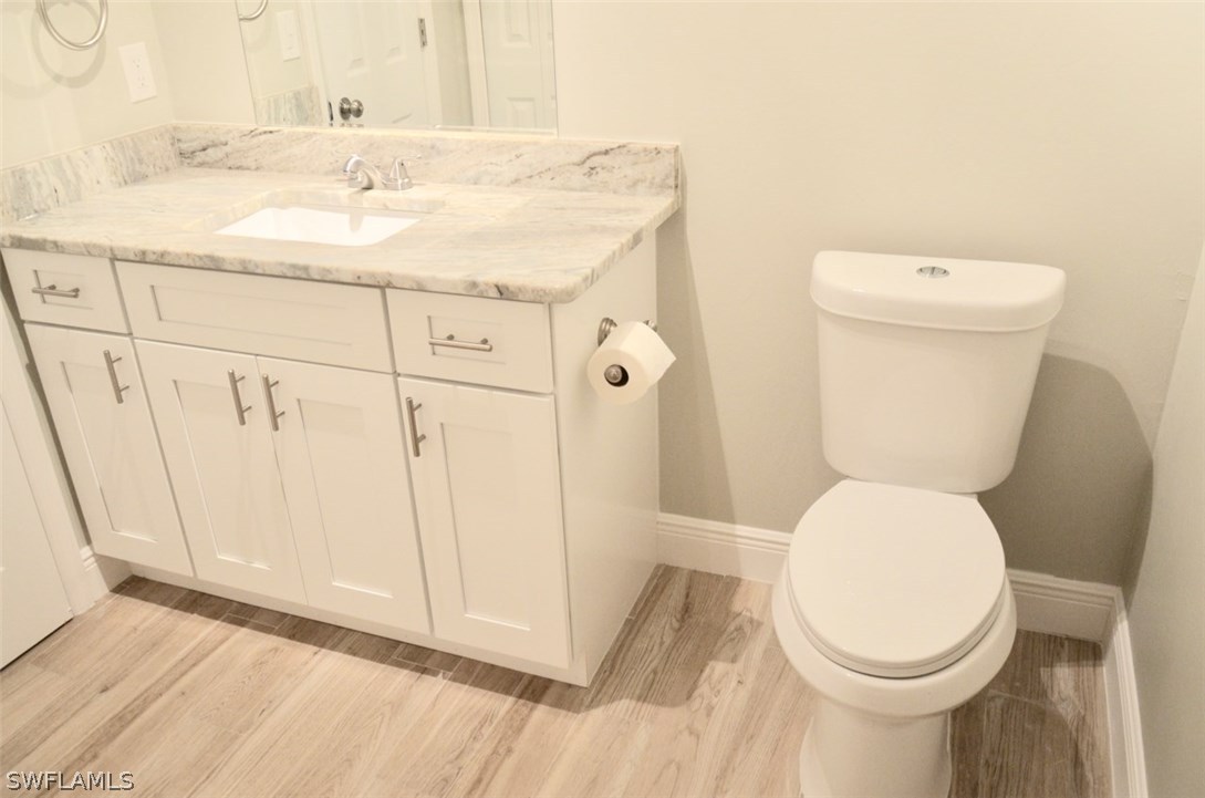 14120 River Road Fort Myers, FL 33905 - Photo 24 of 35 a bathroom with a sink a toilet and a mirror