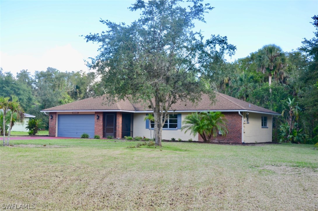 14120 River Road Fort Myers, FL 33905 - Photo 3 of 35 a front view of house with yard and green space
