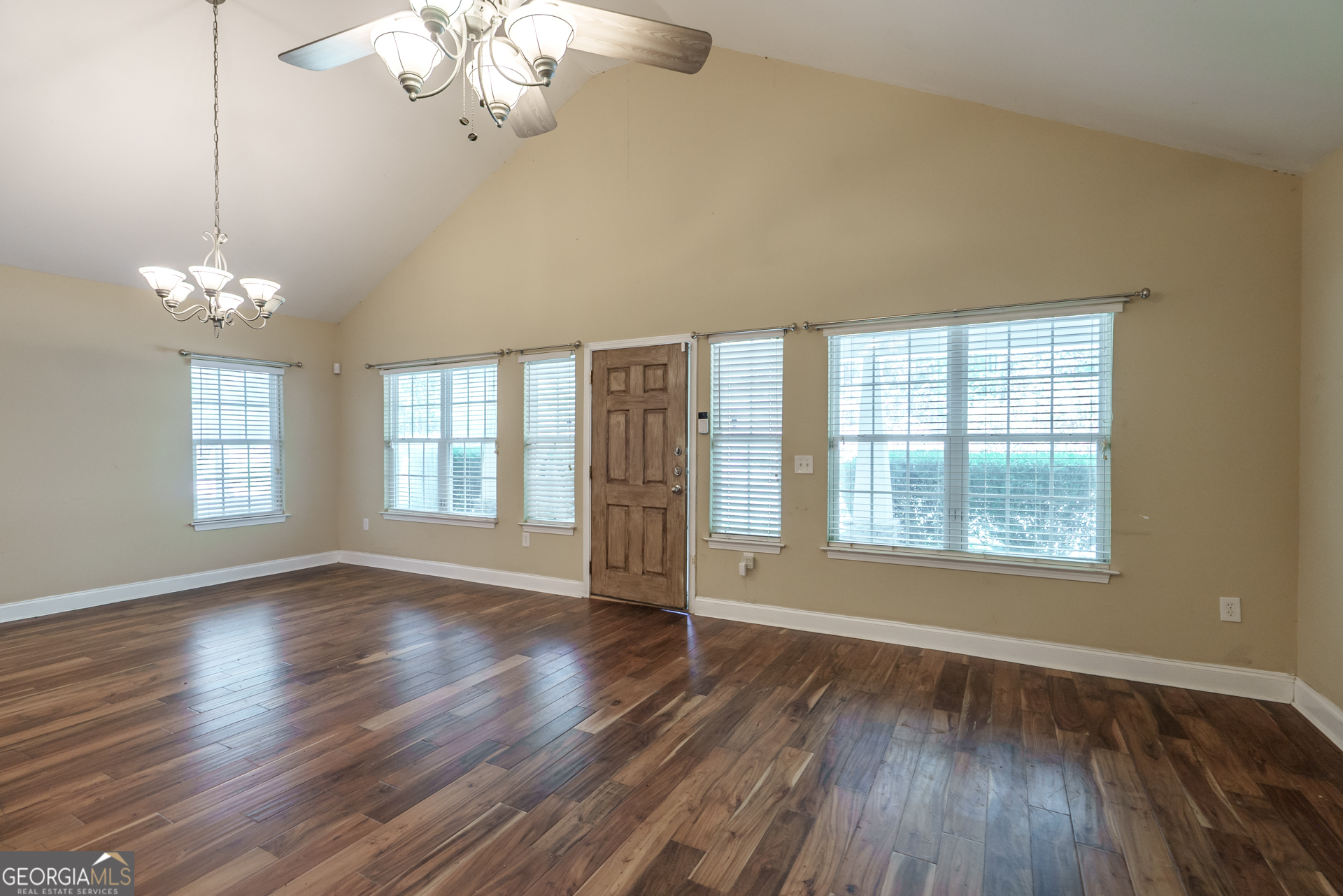 1491 Swords Trail Buckhead, GA 30625 - Photo 11 of 52 a view of an empty room with wooden floor and a window