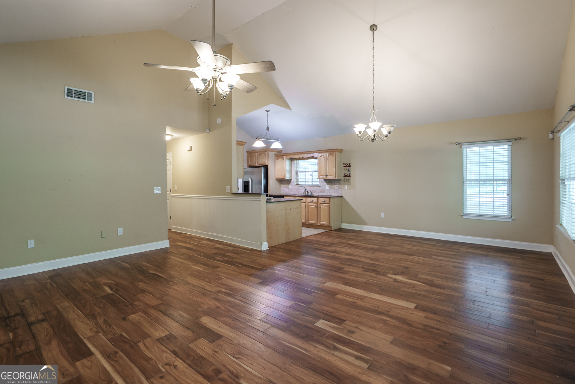 1491 Swords Trail Buckhead, GA 30625 - Photo 12 of 52 a view of a room with wooden floor and chandelier