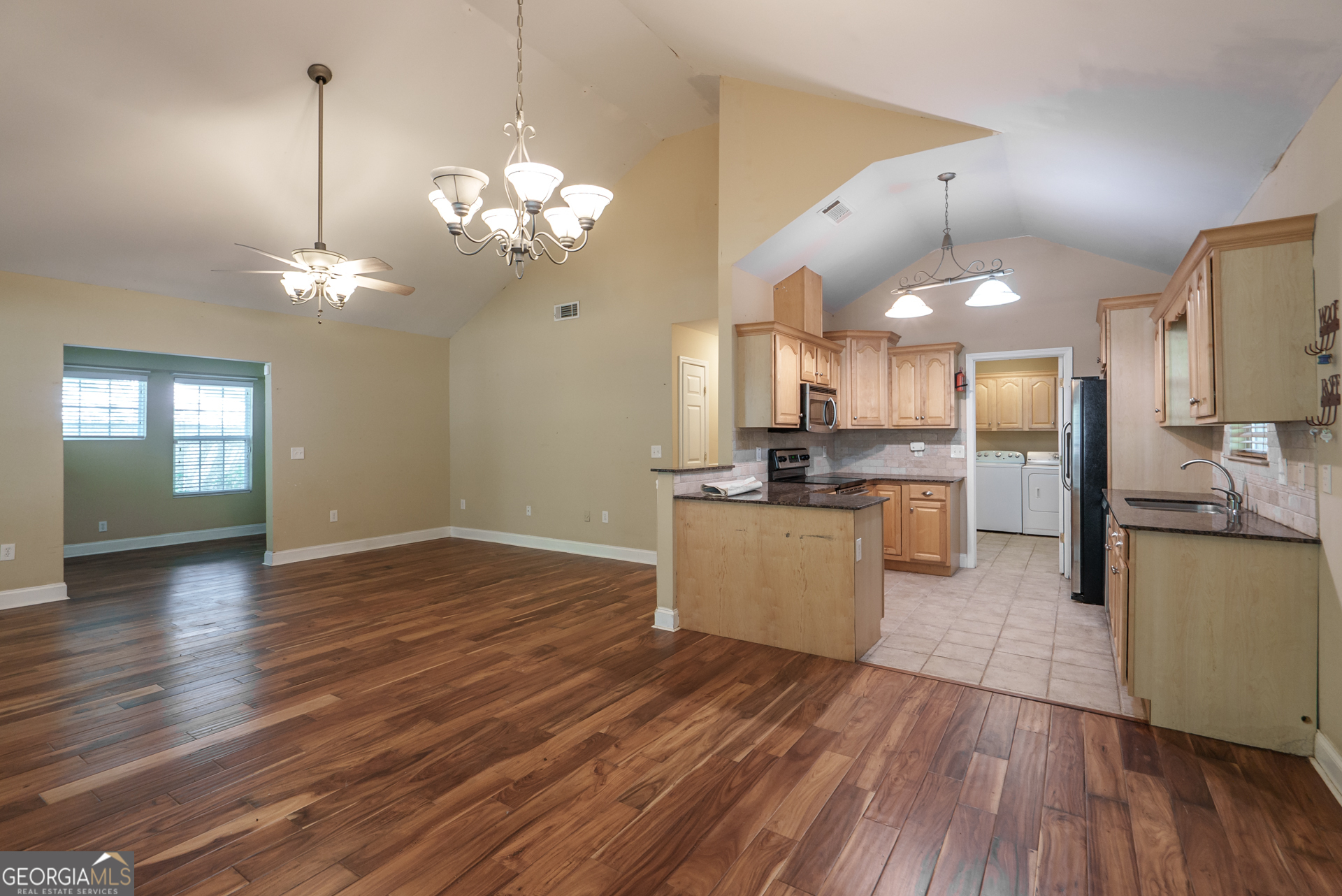 1491 Swords Trail Buckhead, GA 30625 - Photo 13 of 52 a view of a kitchen with stove and wooden floor